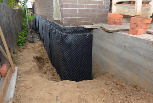 SJ Waterproofing Pros technician performing targeted Exterior Waterproofing assessment in Montezuma, NY